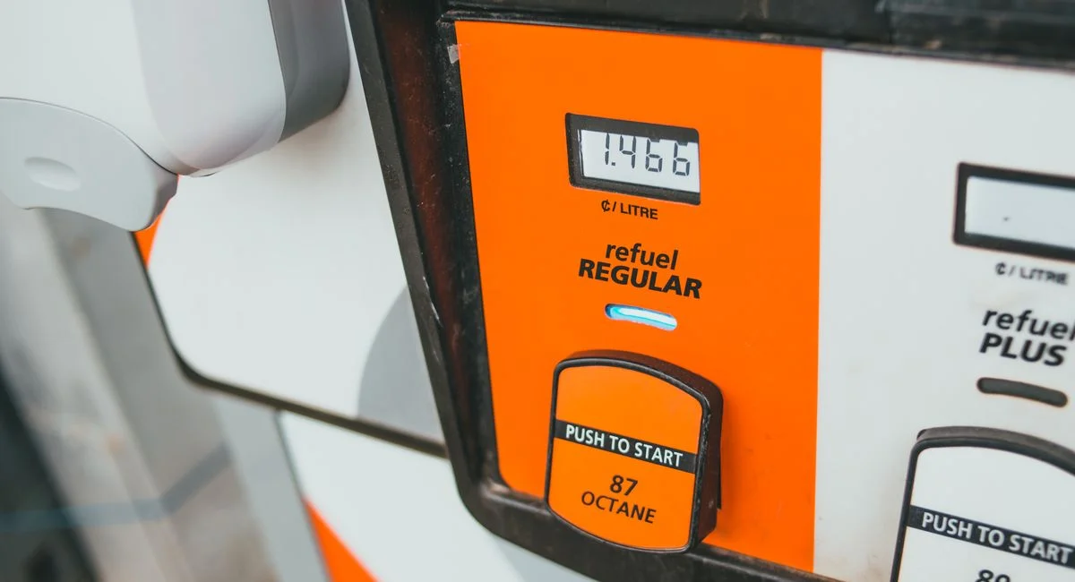 Detailed view of a gas pump showing price and octane level 87.