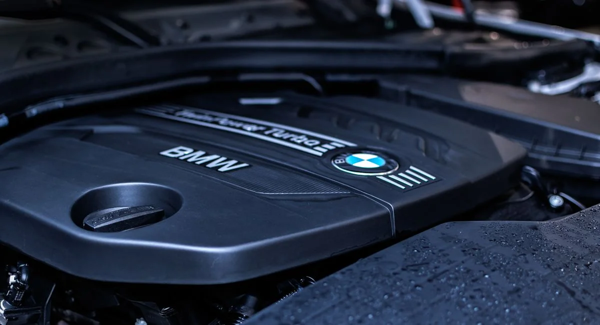 Detailed view of a BMW engine highlighting the turbocharger and modern components.