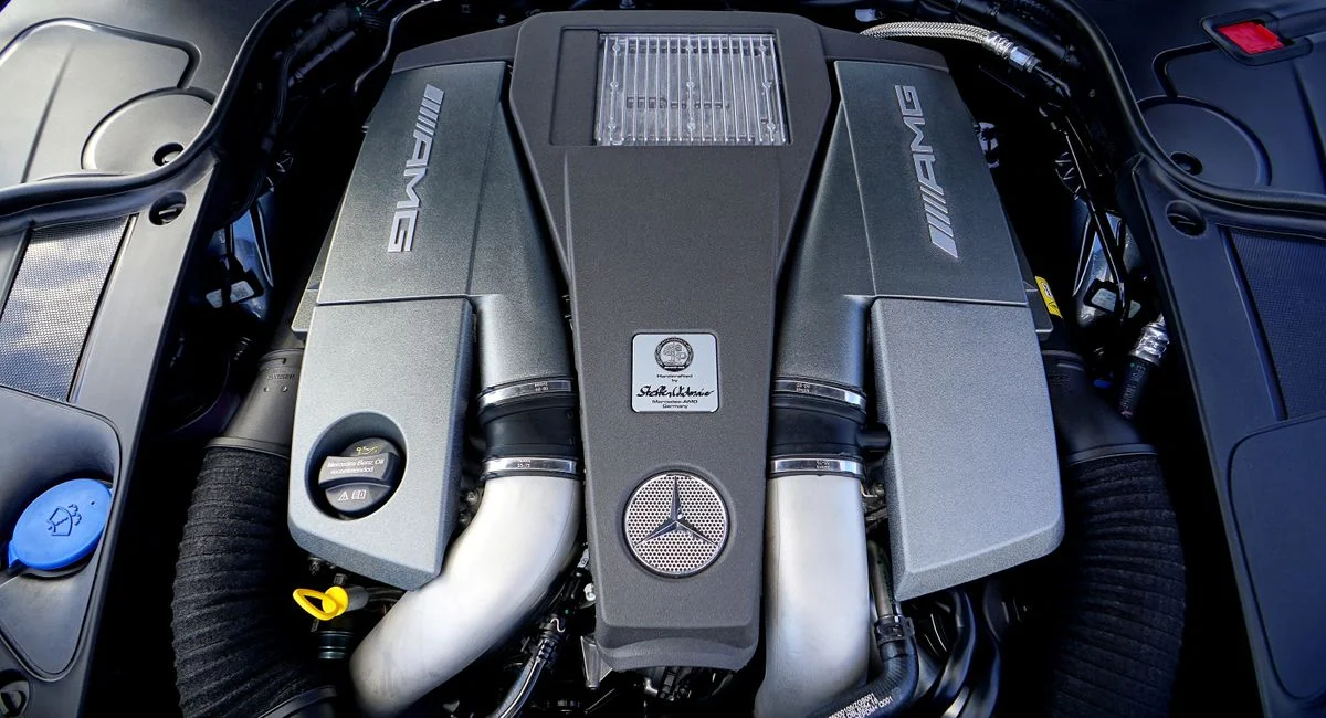Detailed view of a high-performance car engine with AMG branding.